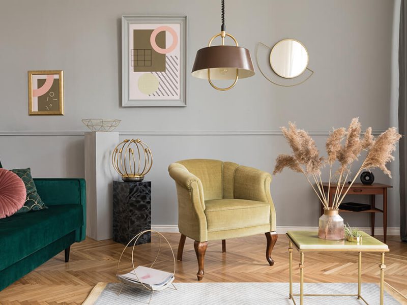 stylish-luxury-living-room-interior-with-elegant-green-velvet-armchair-sofa-coffee-table-marble-stands-design-lamps-art-paintings-chic-accessories-home-decor